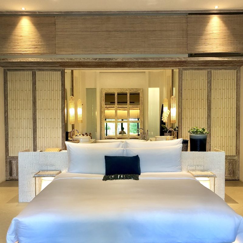 Luxury bedroom interior with rich furniture and scenic view from walkout deck