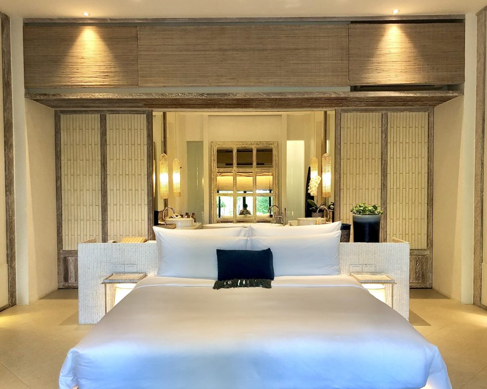 Luxury bedroom interior with rich furniture and scenic view from walkout deck