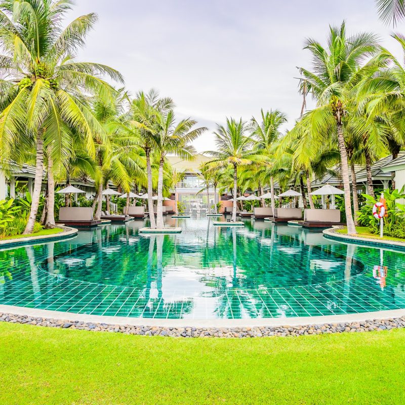 Outdoor Swimming pool in hotel resort for summer vacation background