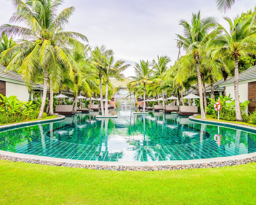 Outdoor Swimming pool in hotel resort for summer vacation background
