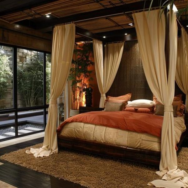bedroom-with-bed-window-that-has-view-woods-scaled