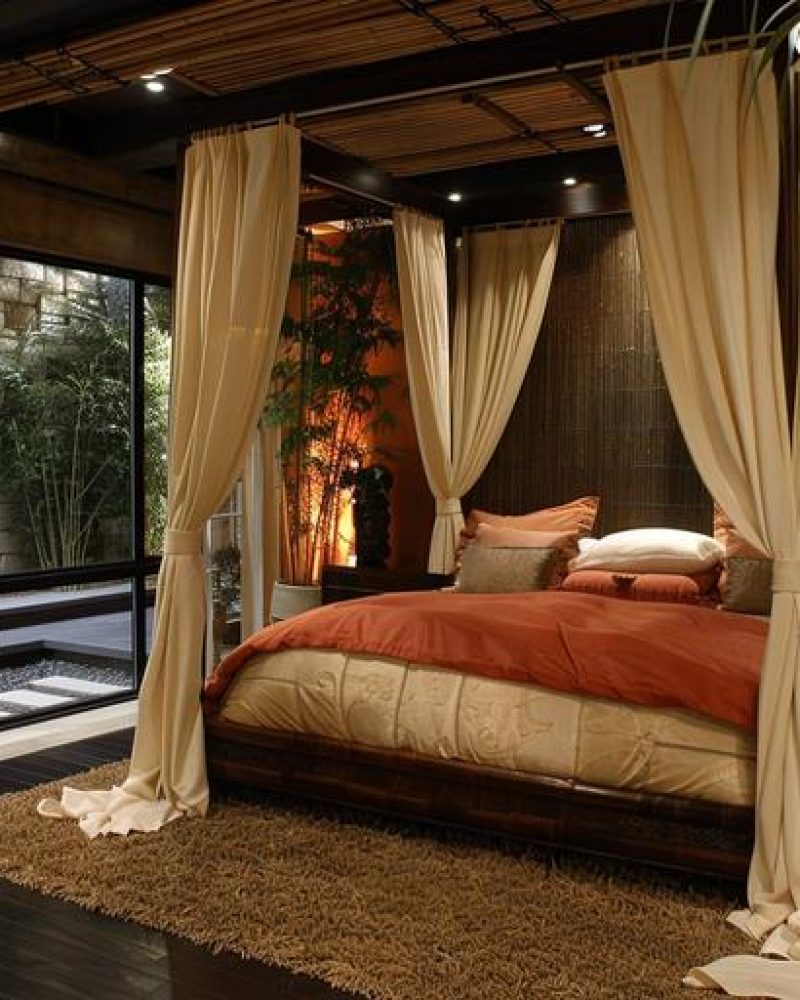 bedroom-with-bed-window-that-has-view-woods-scaled